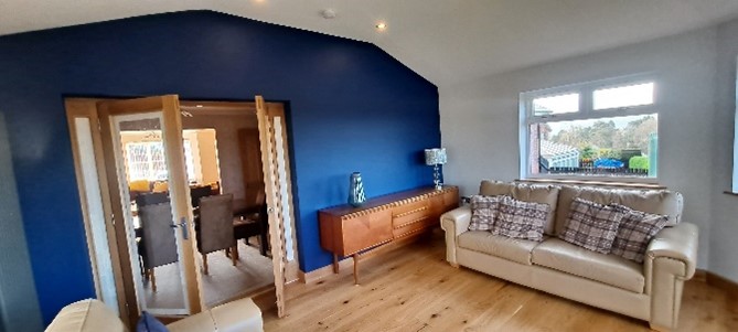 internal sitting room blue wall and couch